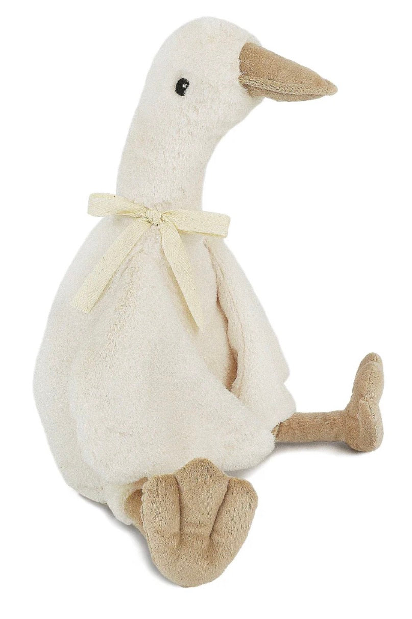 A plush stuffed duck toy in off-white with a cream ribbon bow and tan beak, legs, and feet, photographed on a plain white background.