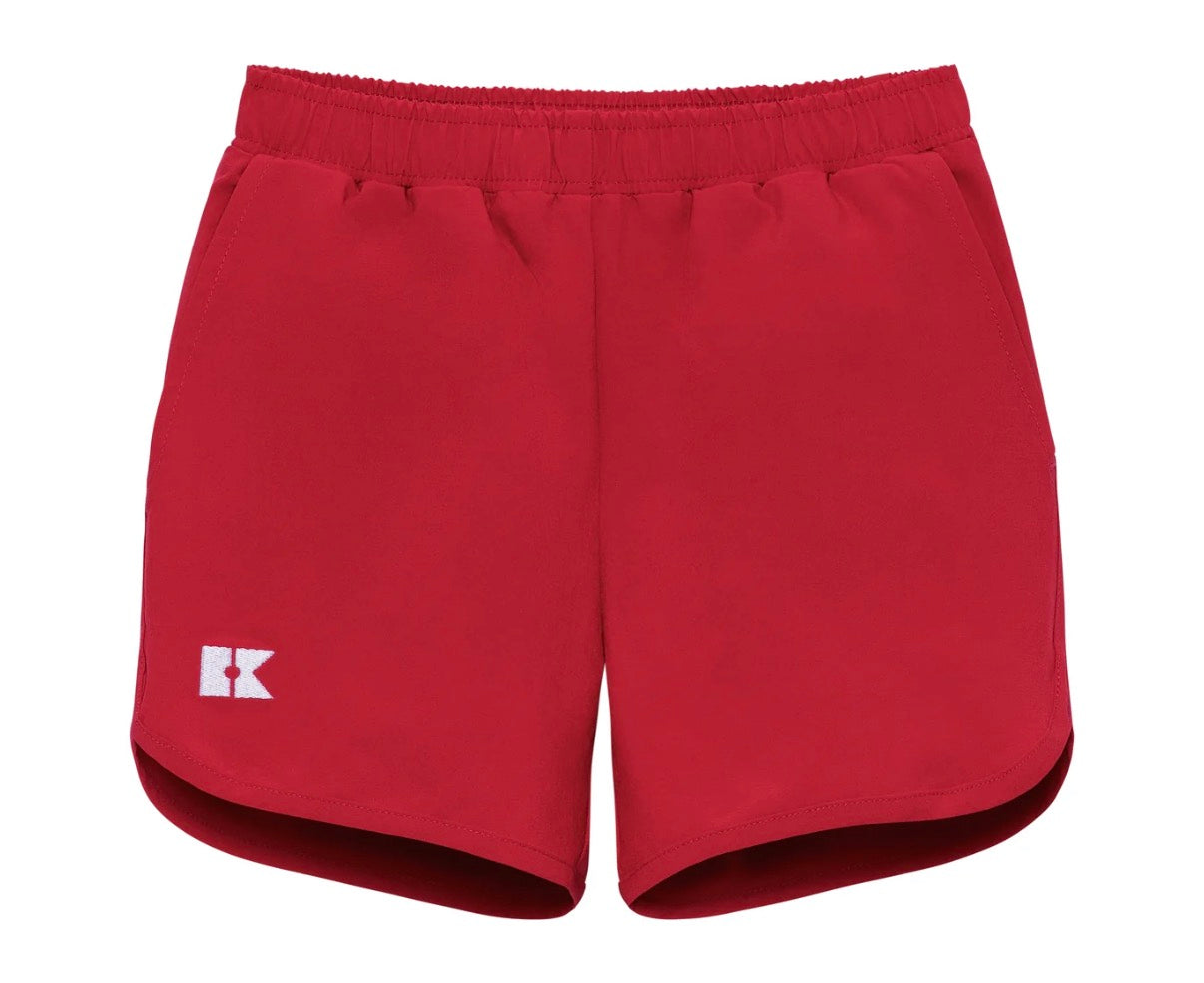 Red shorts with a logo on right front leg