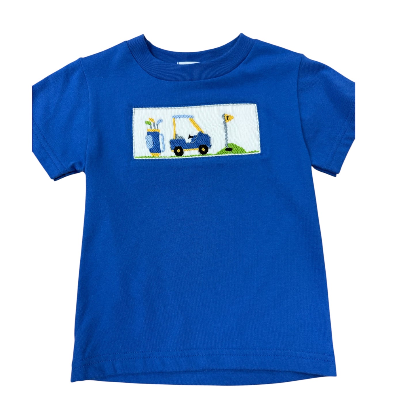 Blue smocked shirt with a graphic of a golf cart and flags on a white background
