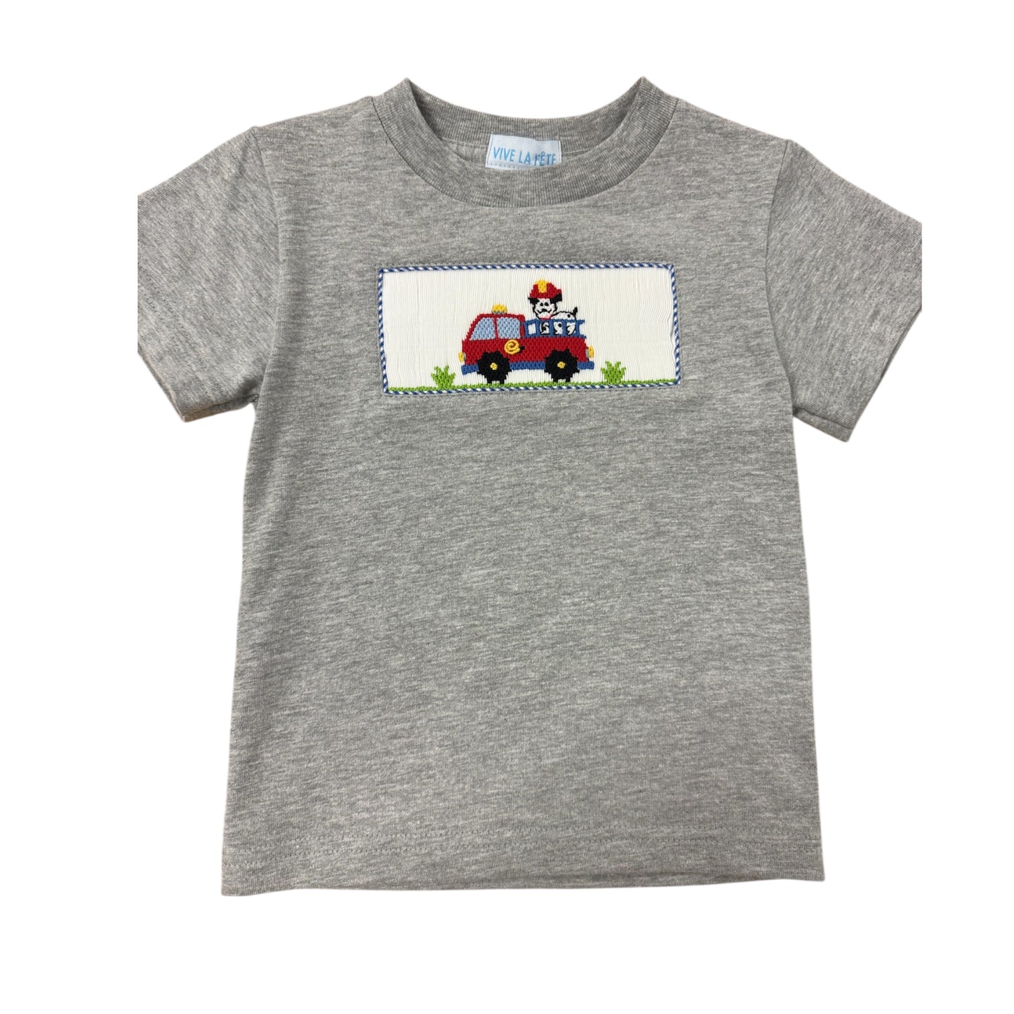 Gray smocked shirt with a fire truck design on a white background