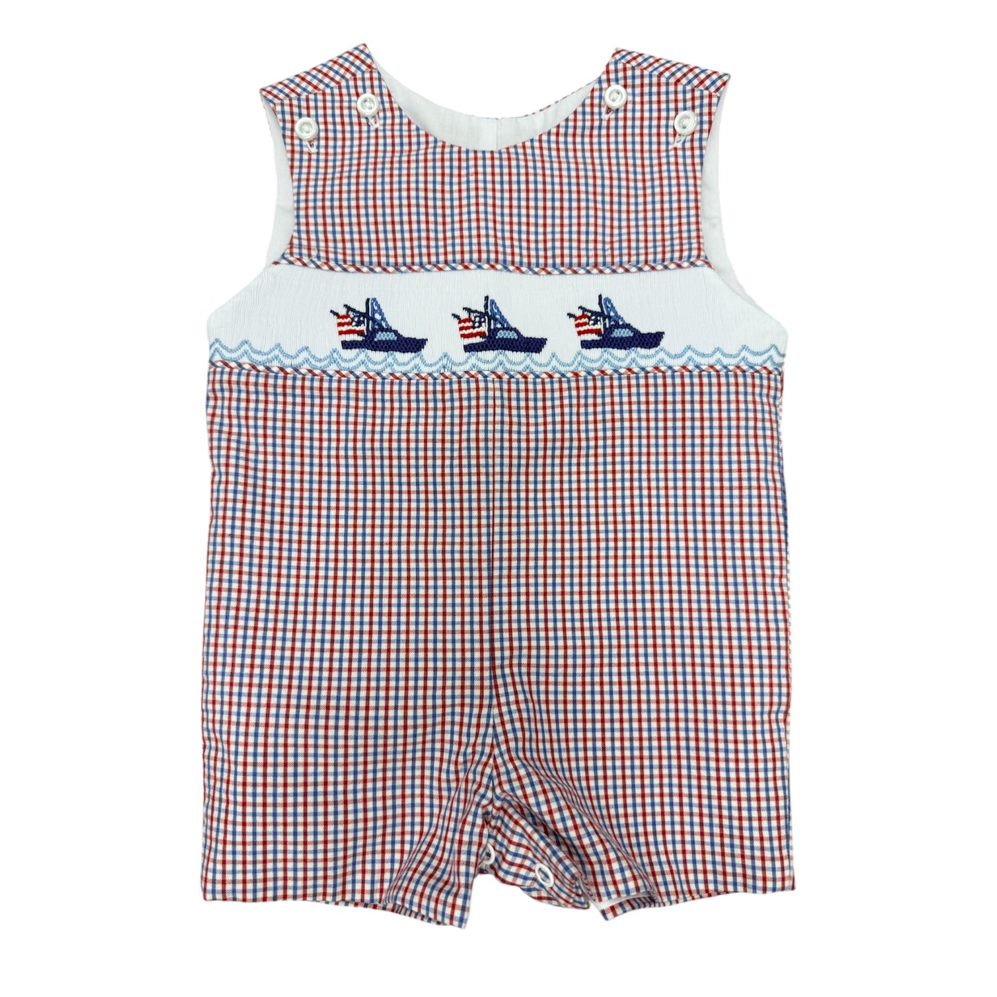 Red, white, and blue checkered smocked baby boy romper with embroidered boats on a white background