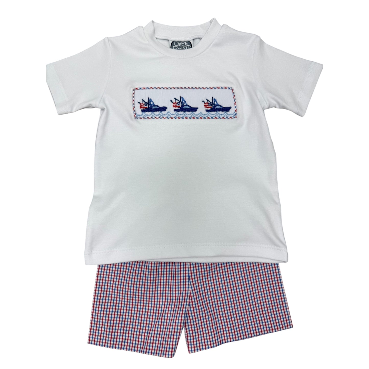 White t-shirt with embroidered boats design and red white and blue checkered shorts