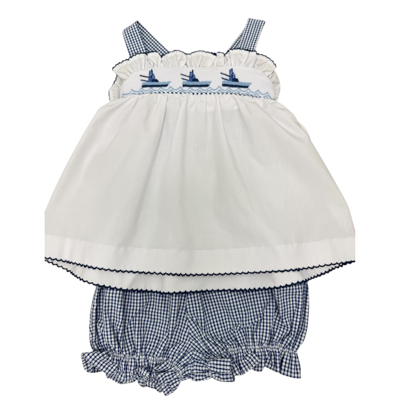 White baby smocked top with navy blue checkered bloomers with three boats across the chest.