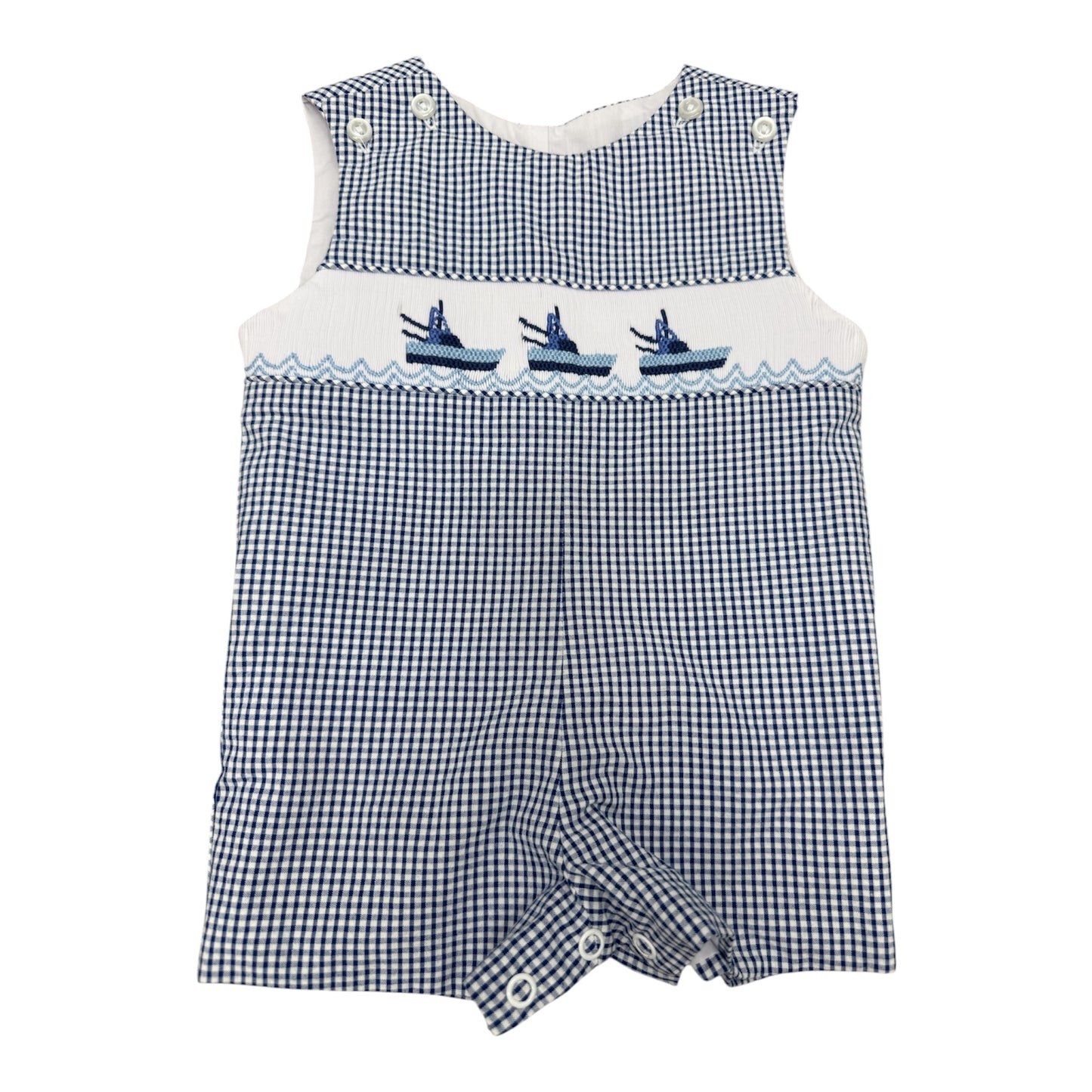 Blue and white checkered smocked romper with embroidered boats on a white background