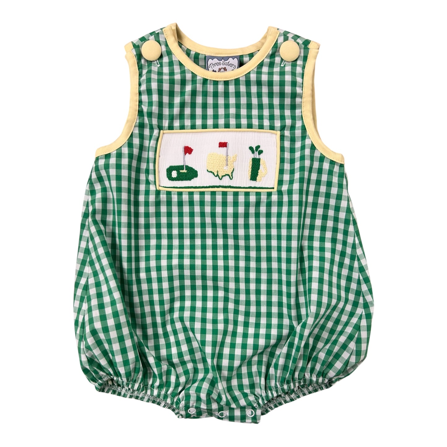 Green checkered baby romper with golf-themed patch on a white background