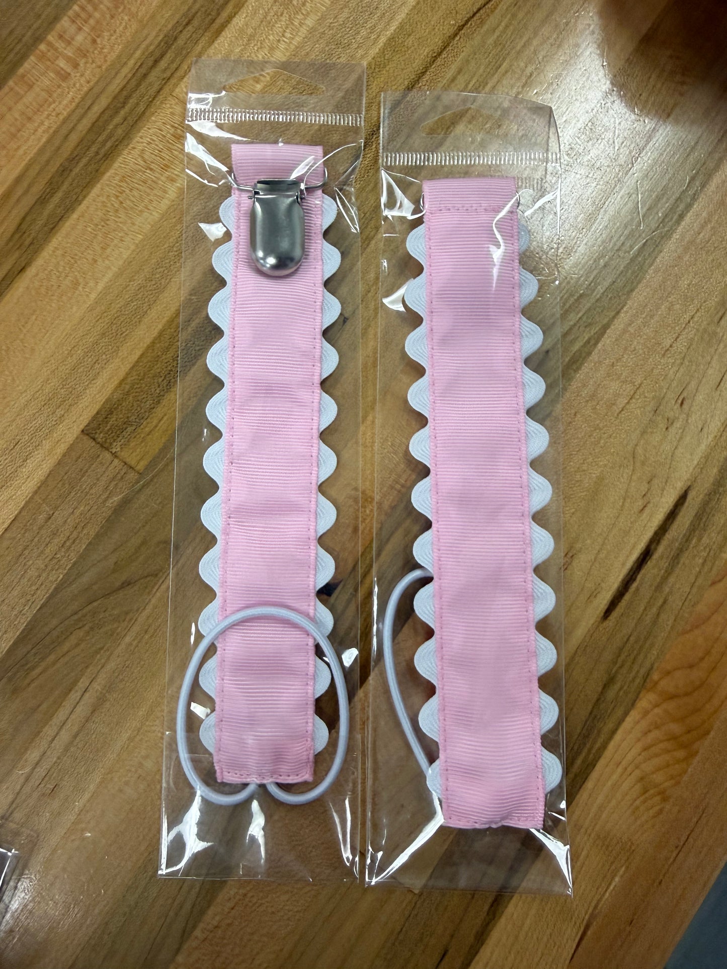 Pink scalloped pacifier holder with metal clip