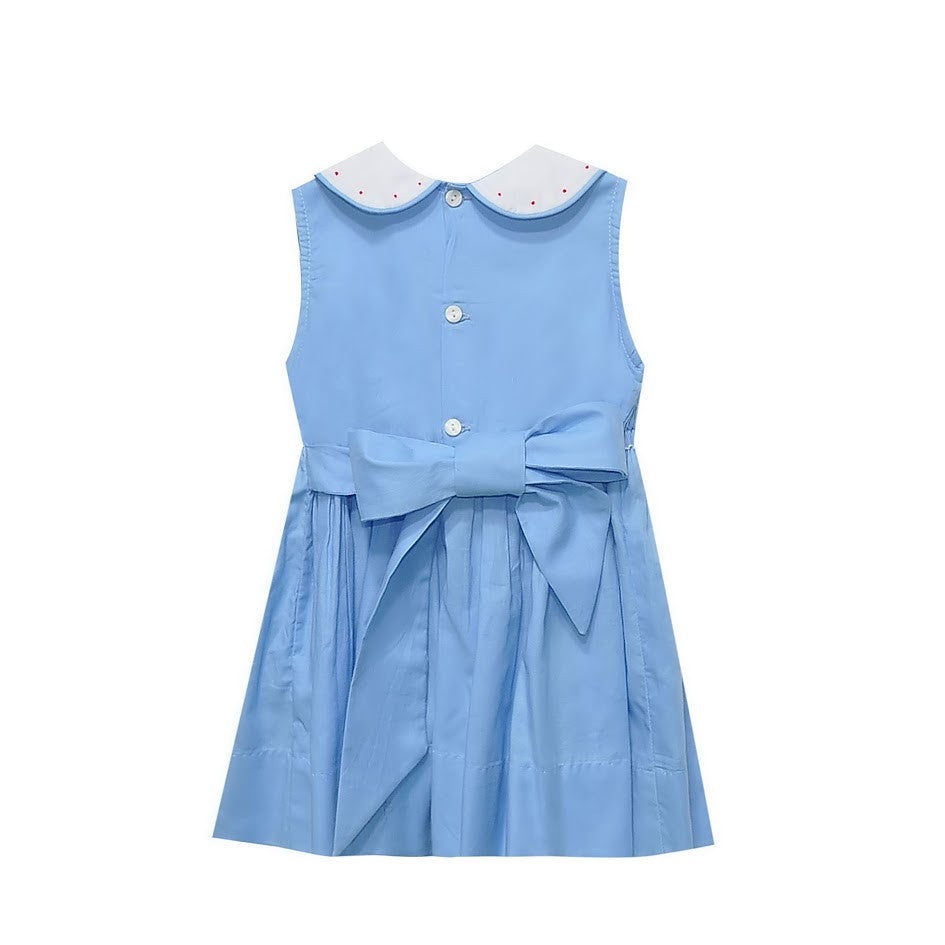 Back of light blue dress showing buttons and bow.