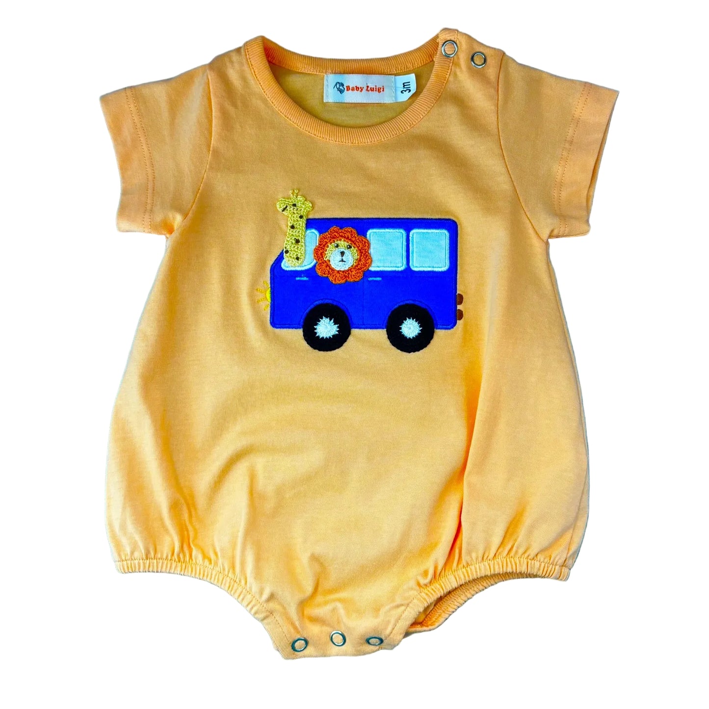 Orange short sleeve bubble with an applique of a blue bus with a giraffe and a lion looking out the windows.