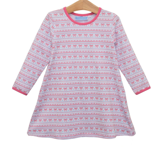 A long-sleeve play dress featuring a pink and white Fair Isle pattern with repeating bows and geometric motifs, complete with a pink crew neck and cuffs.
Details