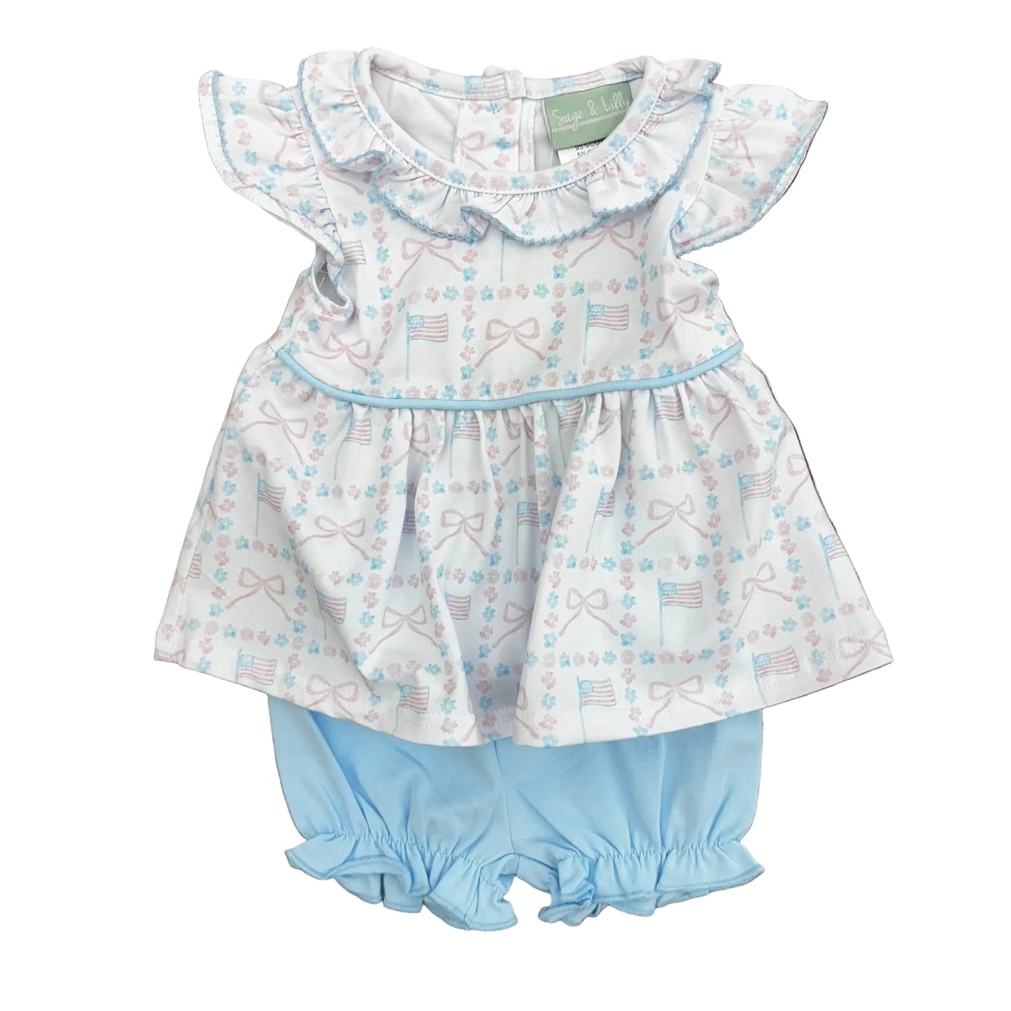Pink and blue flag and bow design on a top with blue trim and ruffle sleeves and collar, with light blue boomers.