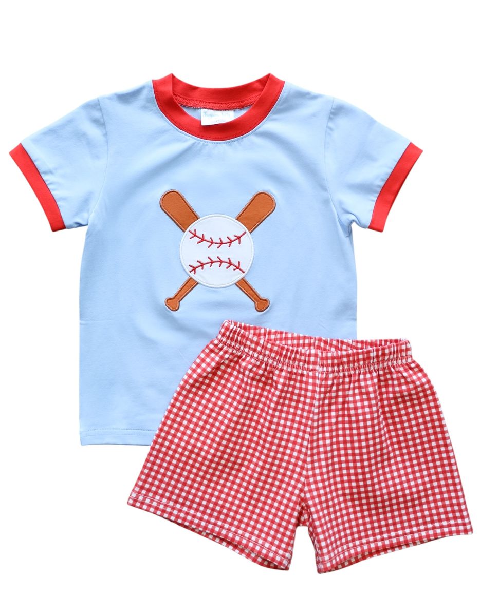Light blue short sleeve tshirt with a baseball applique and red trim and red checked shorts.