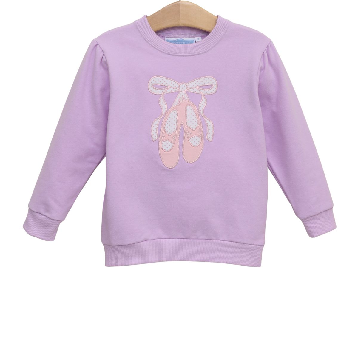 Lavender sweatshirt with ballet slipper design on a white background