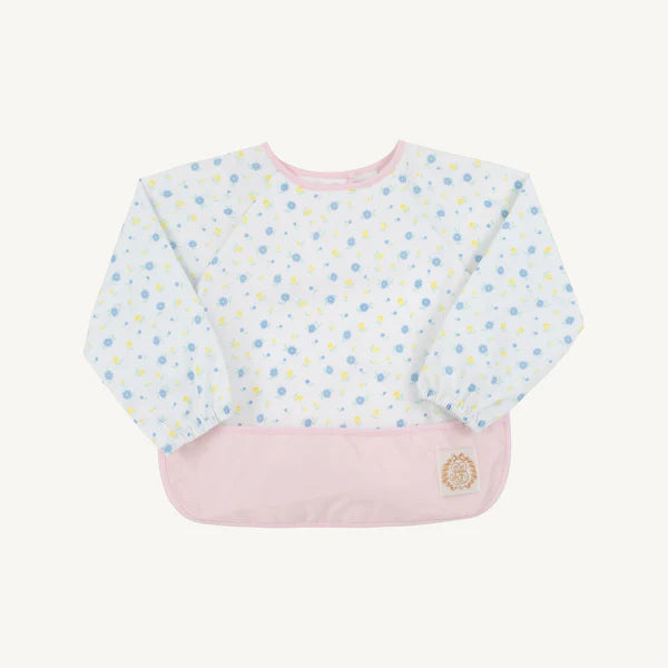 Baby bib with flower pattern on a white background with pink around collar and pink catcher