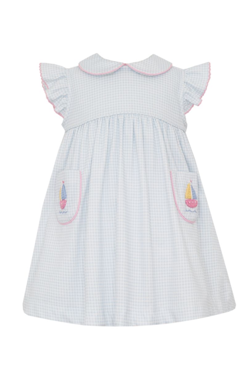 Blue and white checkered dress with pink trim and sailboat designs on pocket