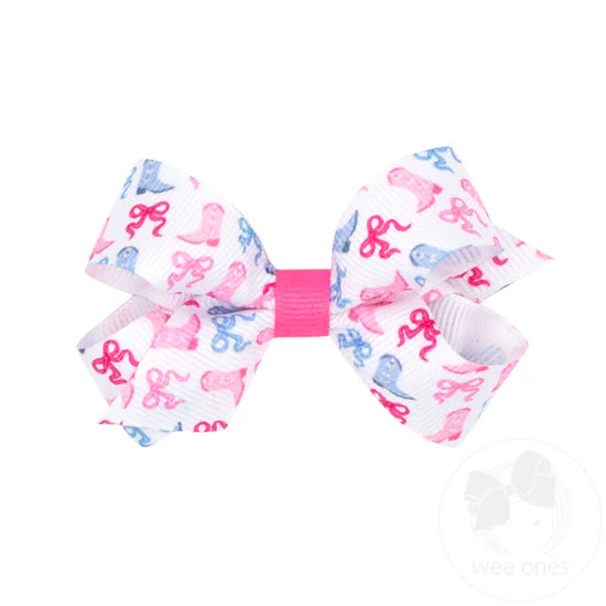 Pink and blue boots and bows on a white hair bow.