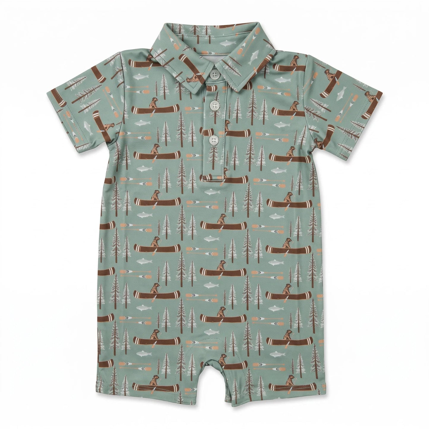 A baby short-sleeve romper in sage green with an all-over print of brown logs, pine trees, and campers, featuring a buttoned collar and snap closure.