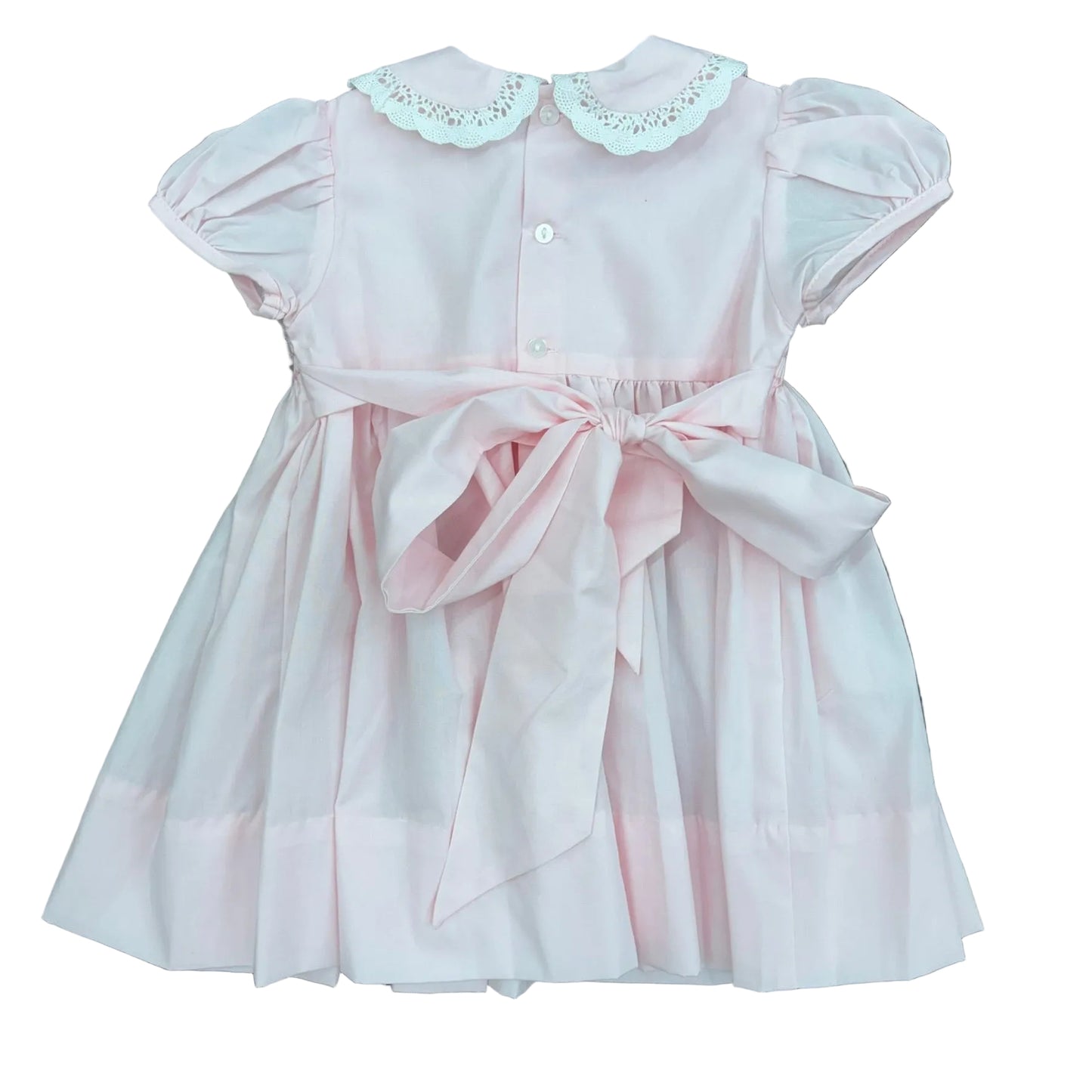 Bow detail on the back of the pink cupcake smocked dress.