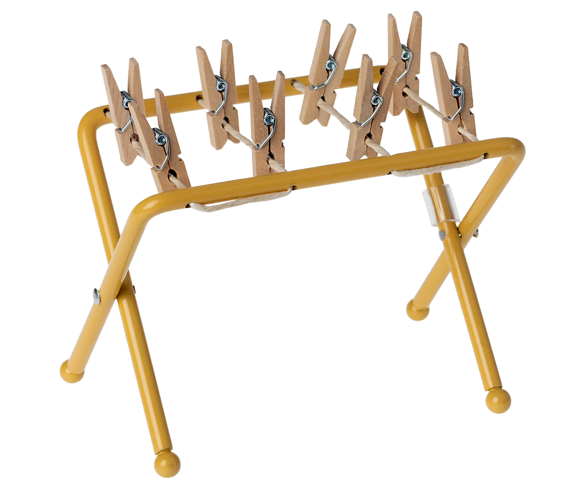 Yellow clothespin rack with wooden pegs for maileg mouse