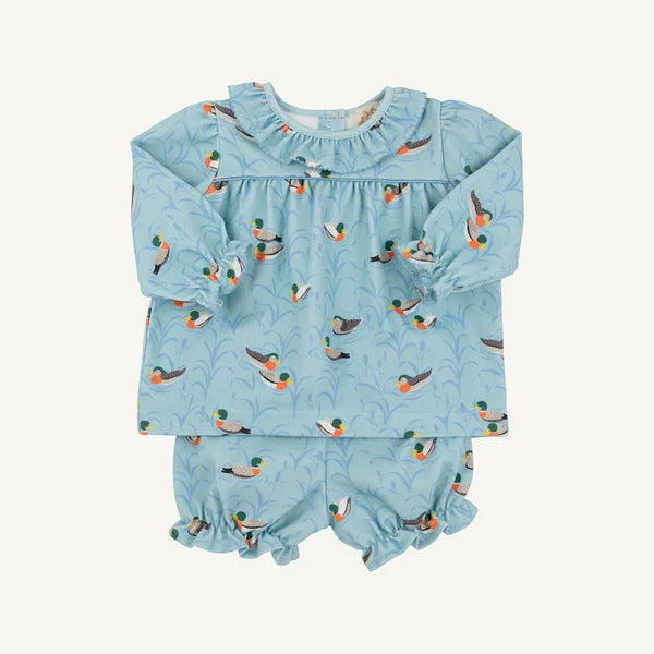 A baby girl's two-piece long-sleeve romper and matching bloomers set in light blue, featuring an all-over duck print with ruffled trim on the neckline and leg openings.
