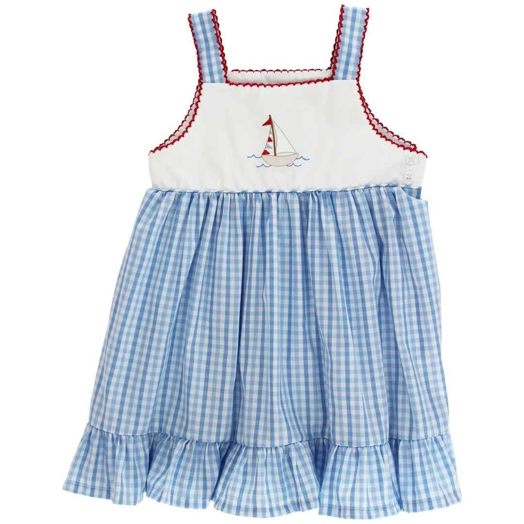 Girls dress with blue checkered pattern and white top with sailboat design on a white background
