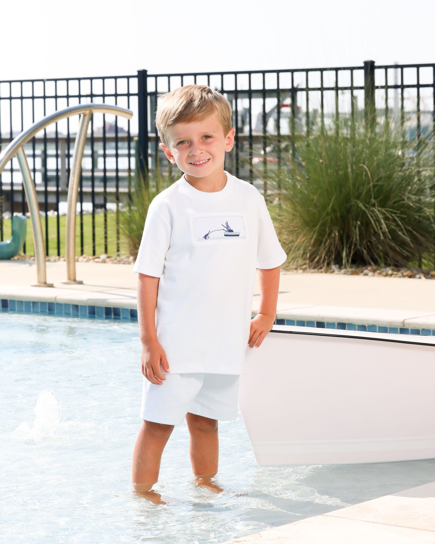 Smocked short set with white smocked top with boat design and light blue/white striped shorts