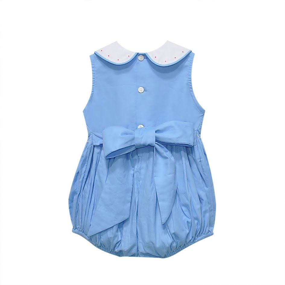 Back of light blue romper showing buttons and bow.