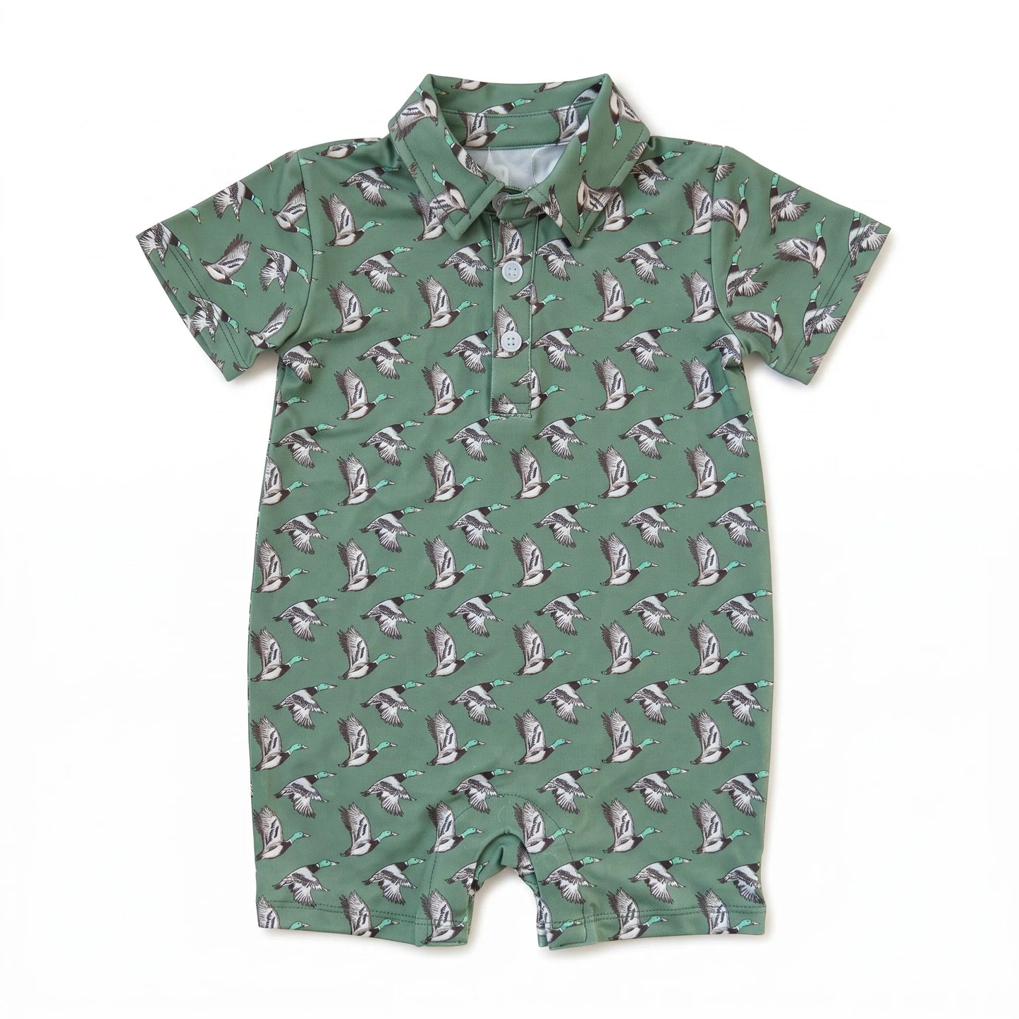 A short-sleeve baby romper in sage green with an all-over repeating print of ducks, shown flat on a white background.