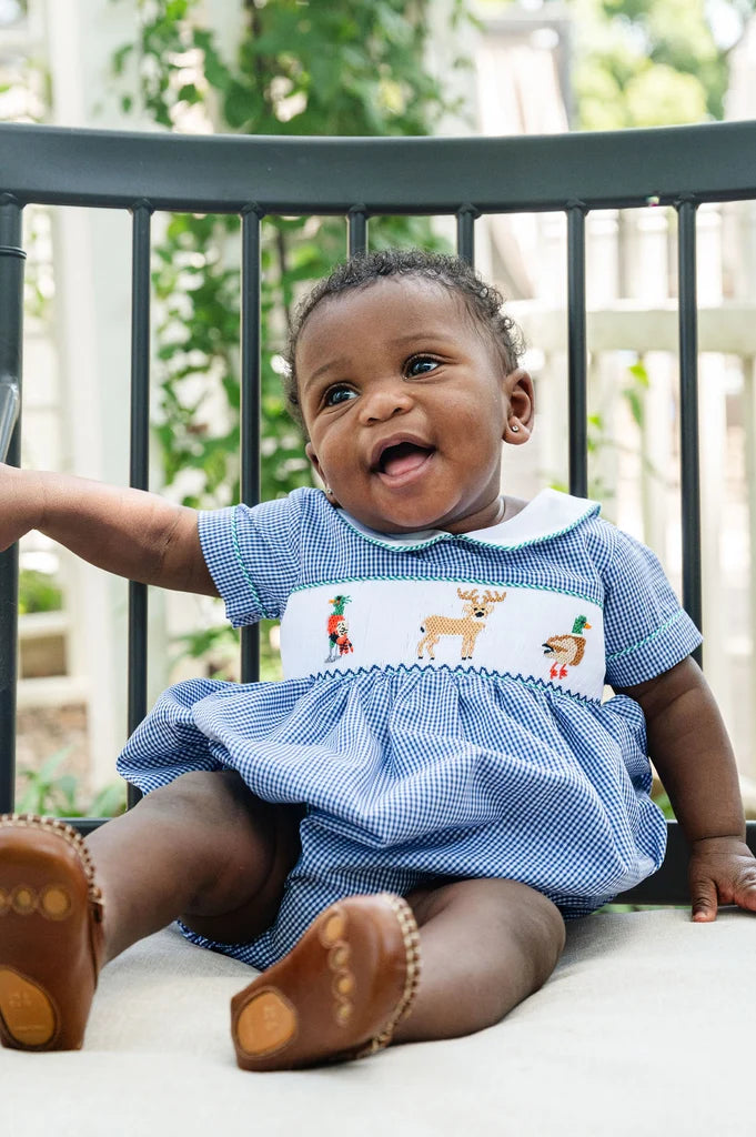 Smocked boy bubble with pheasant, deer and duck design on blue check with white collar