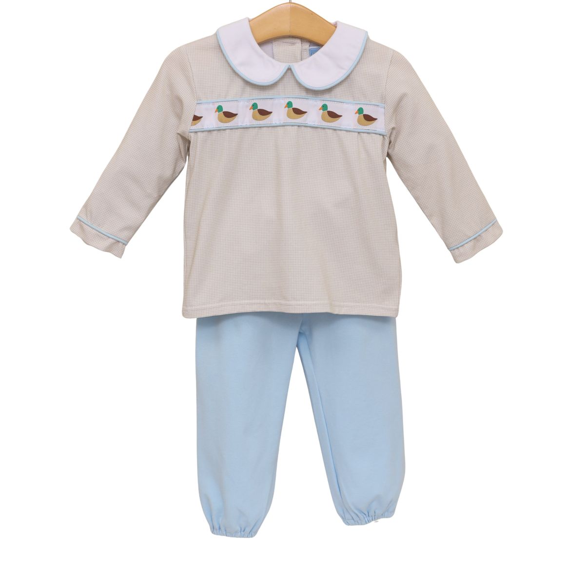 Children's outfit with beige top with mallard design and light blue pants