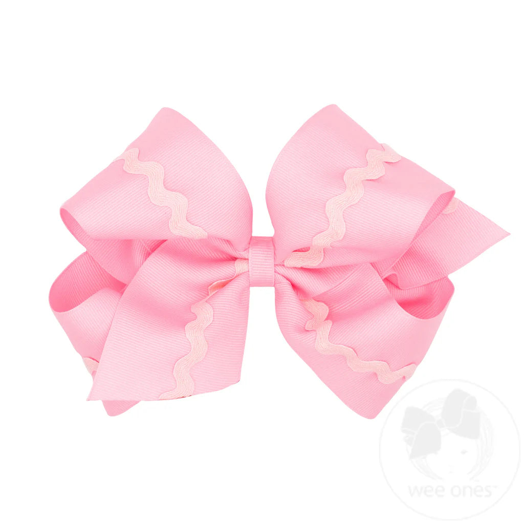 Large light pink hair bow with rick rack design with light pink accents