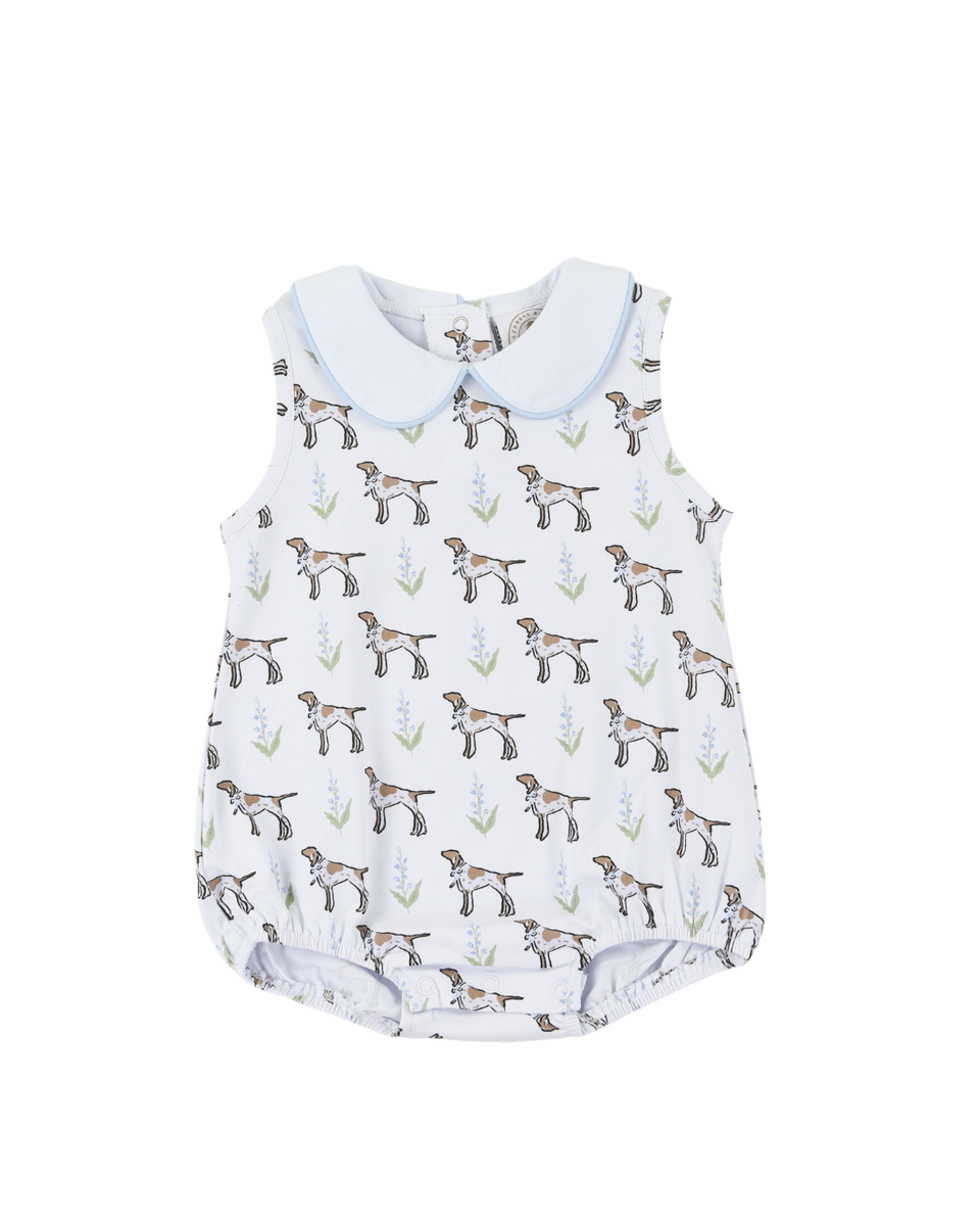 Baby boy romper with dog pattern with a white collar.