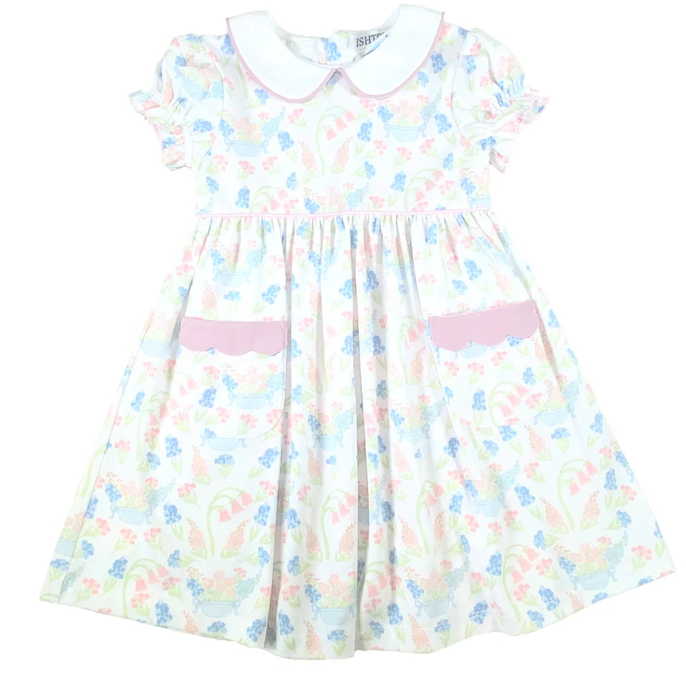 Pastel floral dress with white collar and pink trim.