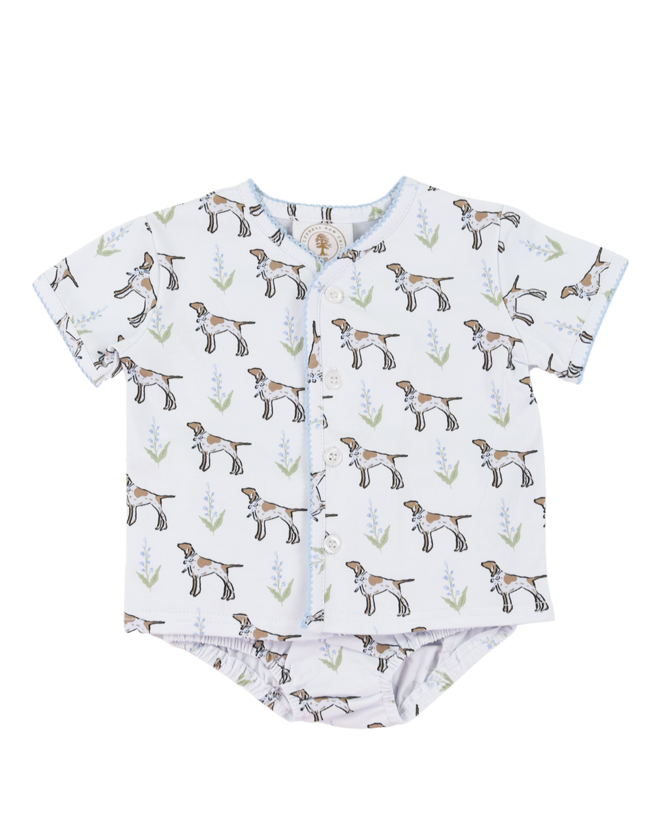 Baby outfit with short-sleeve shirt and diaper cover featuring dog pattern on a white background