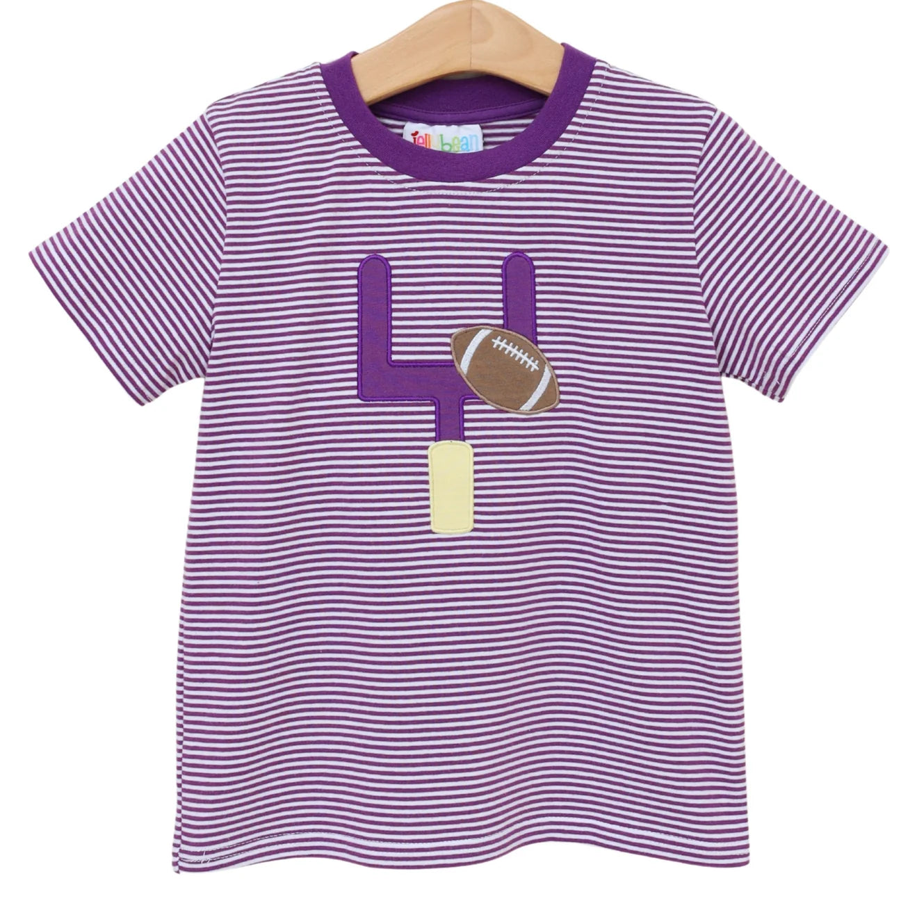 A children's short-sleeve t-shirt with purple and white horizontal stripes, featuring a goal post and a football applique on the front