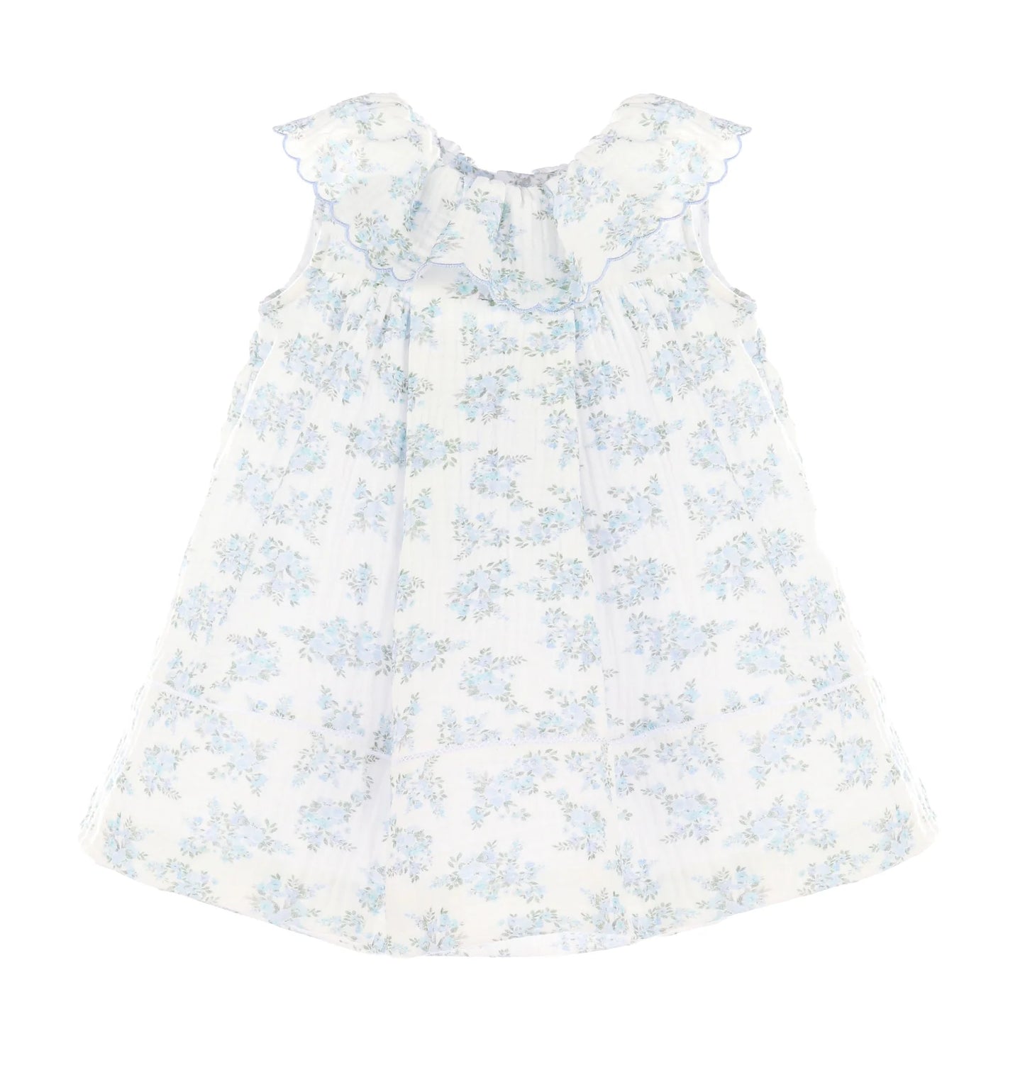 White dress with blue floral pattern on a white background