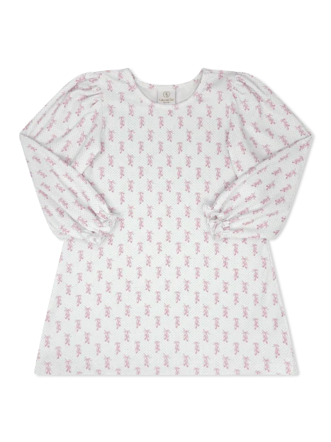 A long-sleeve baby top in white fabric with a delicate pink teddy bear pattern, featuring puffed sleeves and a round neckline.