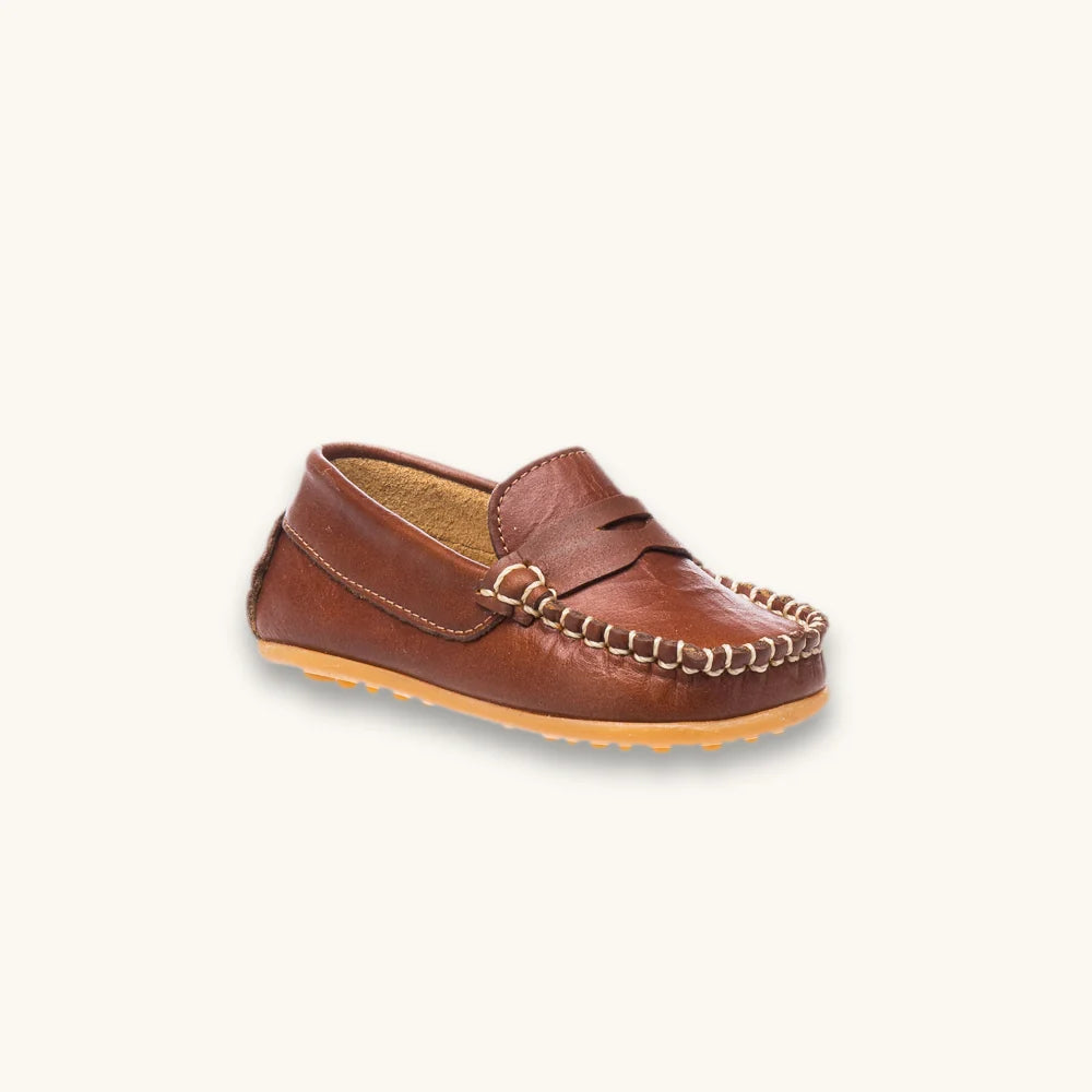 A single brown leather moccasin loafer with decorative chain stitching and a tan sole, shown on a plain off-white background.
