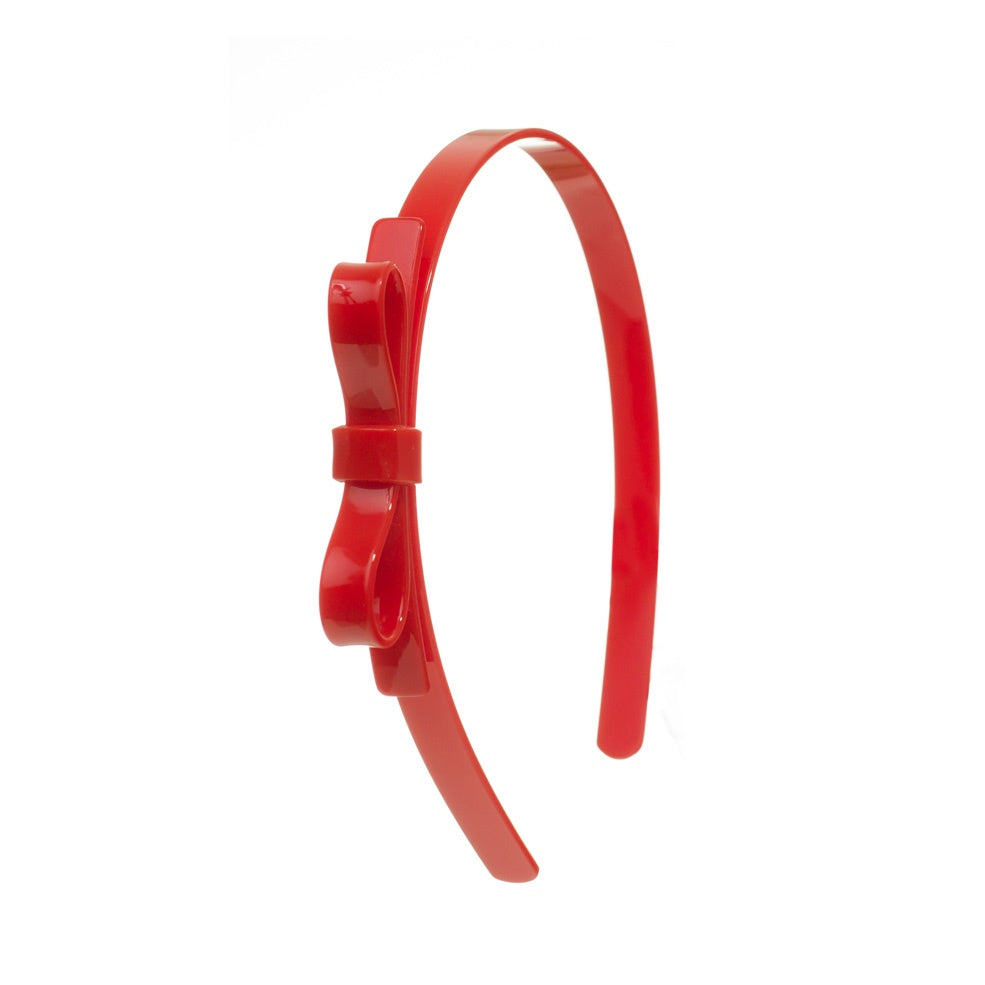 Red headband with a bow on a white background