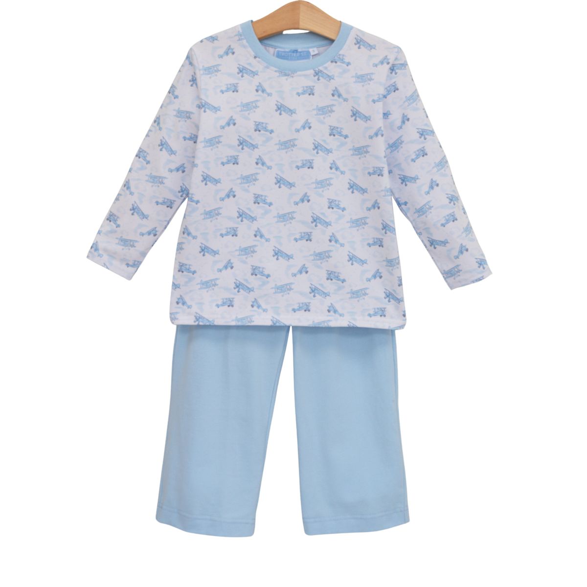 boy pant set with airplane pattern on a white background shirt and blue pants