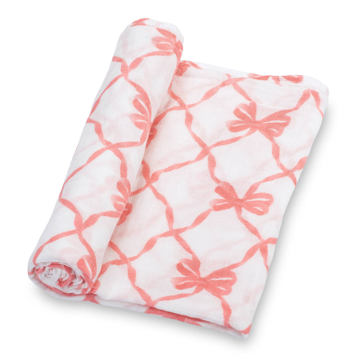 A folded white muslin blanket with a coral pink bow and lattice pattern, shown rolled on a clean white background.