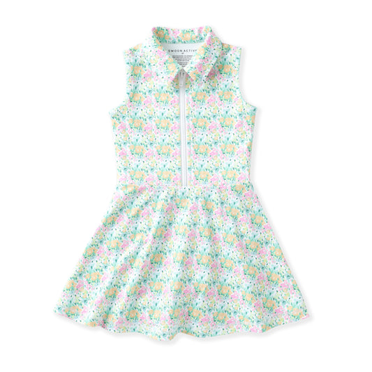 A sleeveless children's dress with a front zipper, pointed collar, and a light pastel floral print on a white background. The print features pink, yellow, and blue flowers with green leaves.