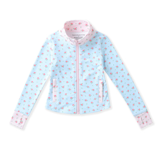 A light blue zip-up jacket with a pink and white tropical print, featuring a pink zipper, pink collar lining, and matching pink cuffs, shown flat on a white background.
