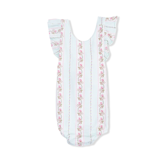 Sunsuit with pink flower detail on cream stripes, on a pale green background.