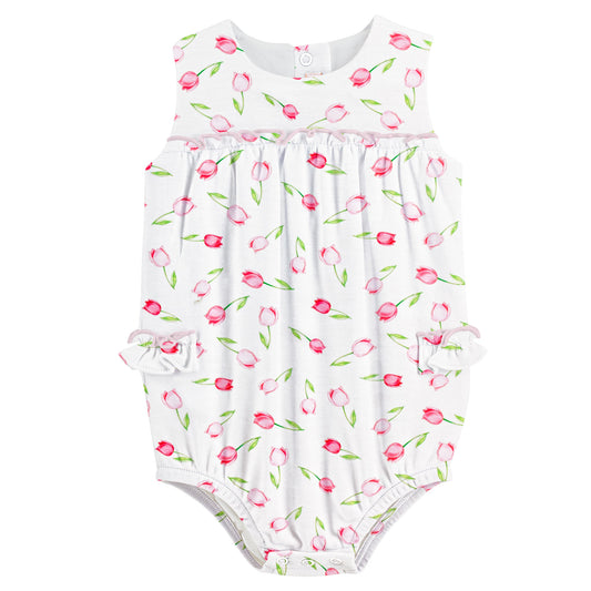 Baby romper with pink tulip pattern on a white background