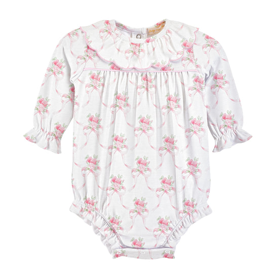 A white long-sleeve baby romper with a pink and green floral print, featuring a ruffled collar, smocked chest, and ruffled cuffs and leg openings.