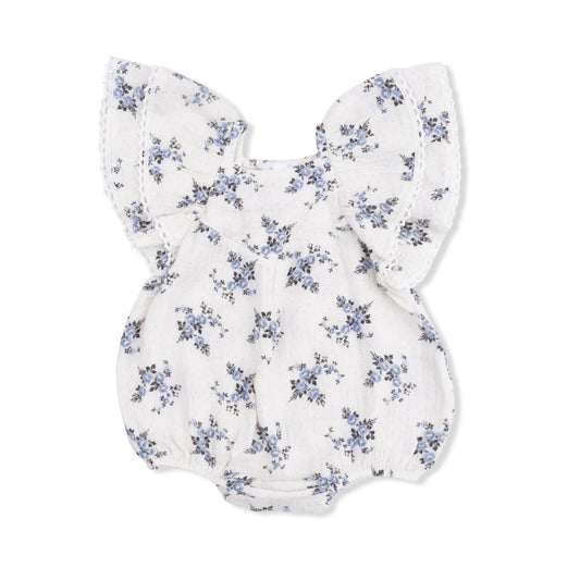 Ruffle sleeve bubble with a seamed v at the neckline and a blue rosette and dot pattern.