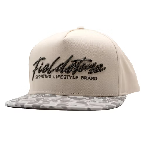 Tan cap with a camouflage bill and the Fieldstone logo.