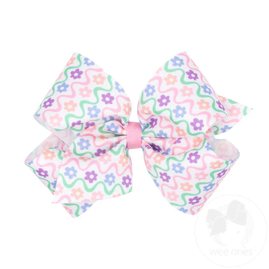 Pastel floral pattern on hair bow.