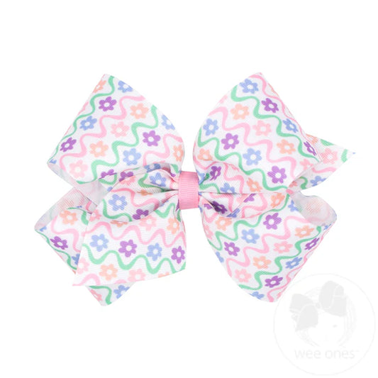 Pastel floral pattern on hair bow.