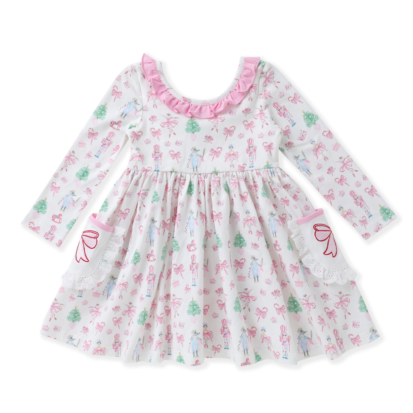 A long-sleeve baby dress with a white base, decorated with a pink and green fairy and bow pattern. It features a pink ruffled neckline, a gathered waist, and lace details on the sleeves and hem.